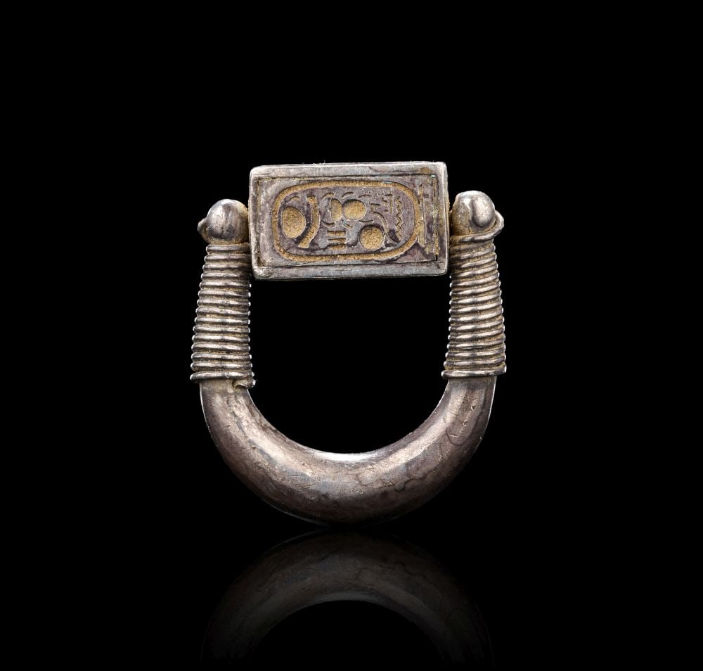 AN EGYPTIAN SILVER INSCRIBED SWIVEL RING FOR PHARAOH HOREMHEB DYNASTY XVIII, 1319-1307 B.C. (1 of 4)
