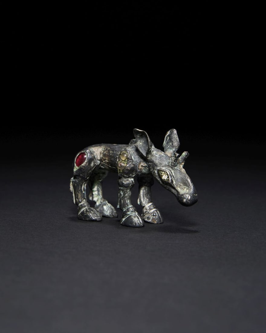 A SCYTHIAN BRONZE GEM SET MOOSE FIGURE, CIRCA 5TH CENTURY B.C. (1 of 2)