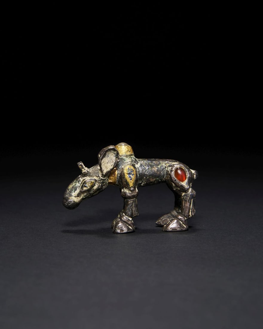 A SCYTHIAN BRONZE GEM SET MOOSE FIGURE, CIRCA 5TH CENTURY B.C. (1 of 2)