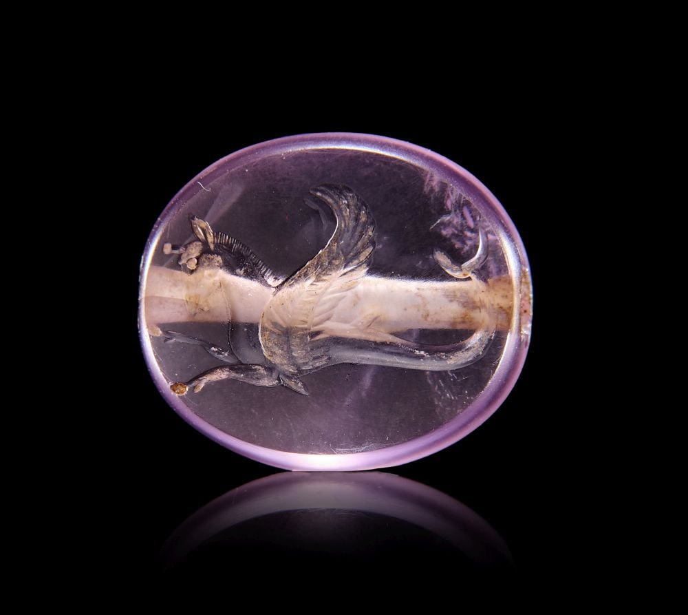 A GREEK AMETHYST SCARABOID WITH A SEA MONSTER, CLASSICAL PERIOD, CIRCA 475–450 B.C.: A GREEK AMETHYST SCARABOID WITH A SEA MONSTER, CLASSICAL PERIOD, CIRCA 475–450 B.C.
