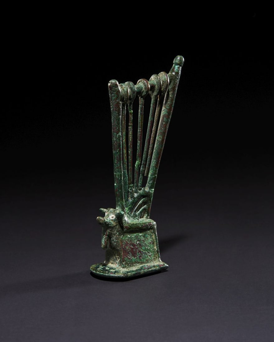 A LURISTAN BRONZE AXE HEAD CIRCA 9TH-7TH CENTURY B.C. (1 of 4)