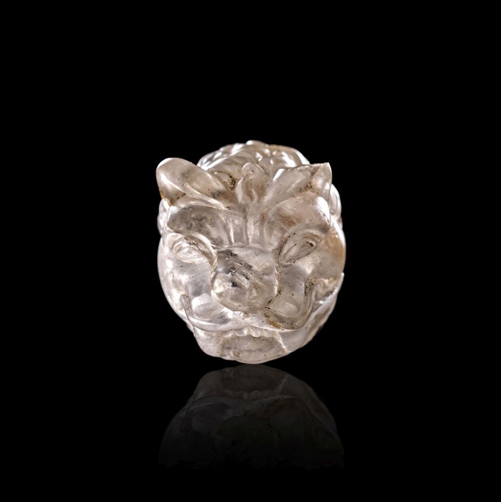 A ROMAN ROCK CRYSTAL FELINE HEAD AMULET, CIRCA 1ST-2ND CENTURY A.D. (1 of 4)
