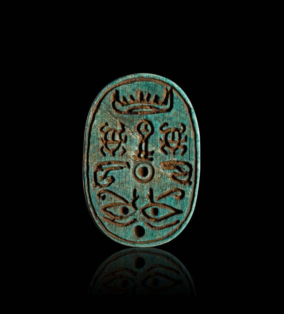 EGYPTIAN FAIENCE STAMP SEAL INSCRIBED WITH HIEROGLYPHICS AND SYMBOLS, MIDDLE KINGDOM, CIRCA: 1850-16 (1 of 2)