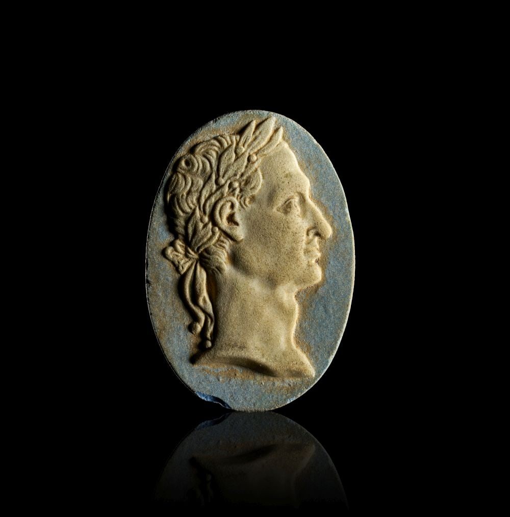 A ROMAN GLASS CAMEO PORTRAIT OF EMPEROR TIBERIUS JULIO-CLAUDIAN PERIOD, CIRCA 1ST CENTURY A.D. (1 of 2)