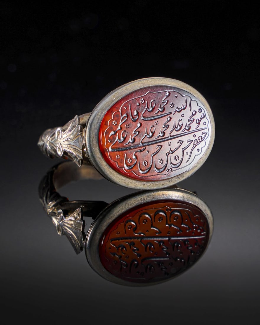 A CALLIGRAPHIC INSCRIBED CARNELIAN RING ON SILVER, 19TH CENTURY, PERSIA (1 of 2)