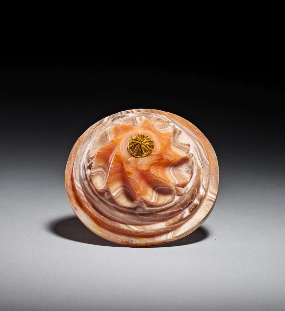 A BYZANTINE BANDED AGATE ARCHITECTURAL DOOR ORNAMENT WITH BRONZE PIN & GOLD CROSS FINIAL, CIRCA 6TH-: A BYZANTINE BANDED AGATE ARCHITECTURAL DOOR ORNAMENT WITH GOLD CROSS FINIAL AND BRONZE PIN, CIRCA 6TH–7TH CENTURY A.D. Carved from richly banded agate, this substantial Byzantine architectural