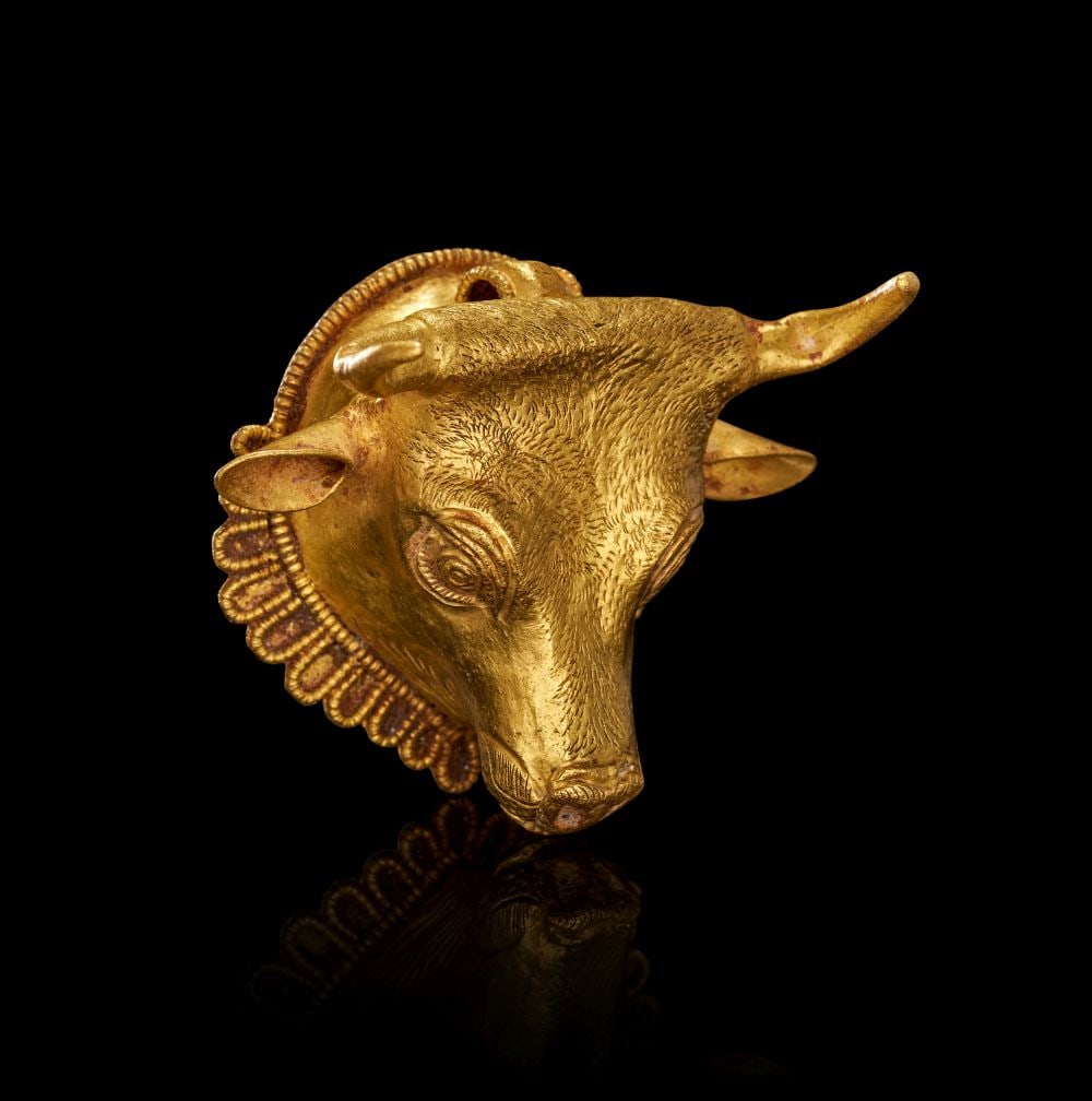 A GREEK GOLD PENDANT IN THE FORM OF A BULL HEAD HELLENISTIC PERIOD, CIRCA 3RD-2ND CENTURY B.C.: A GREEK GOLD PENDANT IN THE FORM OF A BULL’S HEAD Hellenistic Period, circa 3rd–2nd Century B.C. A beautifully modelled gold pendant formed as the head of a