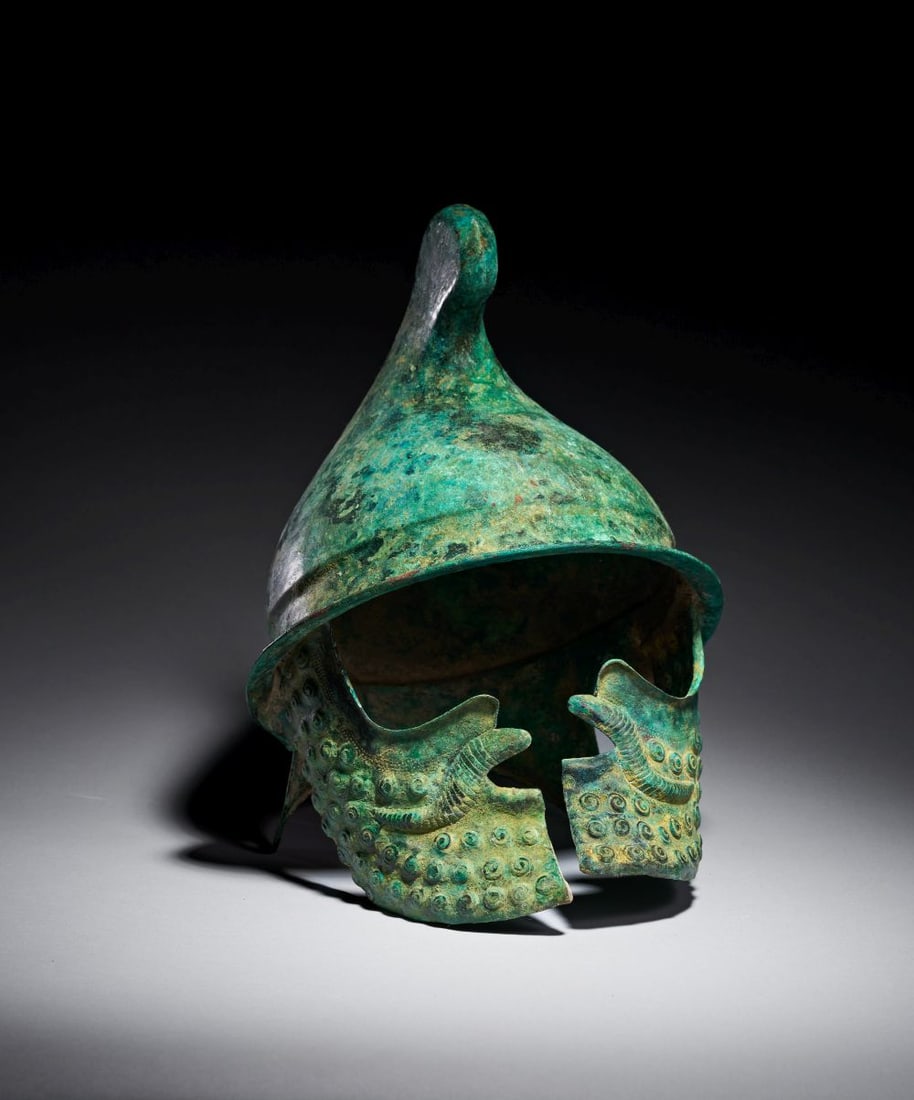 A GREEK BRONZE PHRYGIAN HELMET LATE CLASSICAL TO EARLY HELLENISTIC PERIOD, CIRCA 350-300 B.C. (1 of 12)