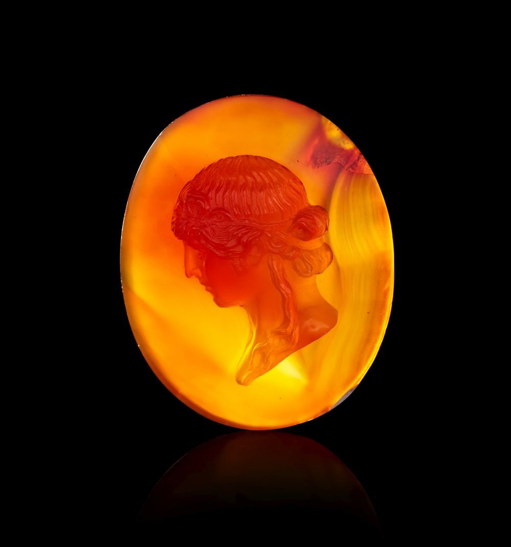 A RARE LARGE ROMAN AGATE CAMEO DEPICTING APOLLO, CIRCA 1ST-2ND CENTURY A.D.:  A RARE LARGE ROMAN AGATE CAMEO DEPICTING APOLLO CIRCA 1ST–2ND CENTURY A.D. Finely carved in warm-toned agate of rich honey and amber hues, the oval cameo depicts the youthful