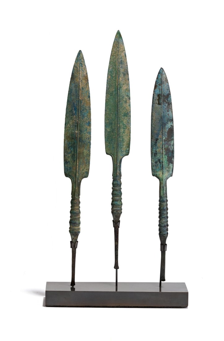 THREE NEAR EASTERN COPPER ALLOY SPEAR HEADS, BRONZE AGE, CIRCA 3RD-2ND MILLENNIUM B.C.: THREE NEAR EASTERN COPPER ALLOY SPEAR HEADS BRONZE AGE, CIRCA 3RD–2ND MILLENNIUM B.C. Each cast in copper alloy with elongated leaf-shaped blades, the surfaces covered in varied gr