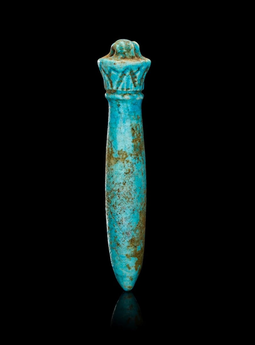 AN EGYPTIAN PALE BLUE FAIENCE WADJ PAPYRUS-COLUMN AMULET LATE PERIOD, DYNASTY XXVI-XXX, CIRCA 664-33 (1 of 2)