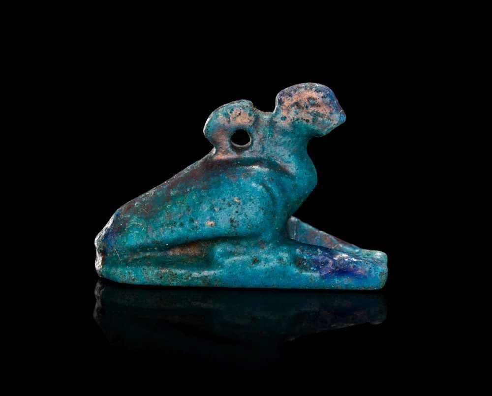 AN EGYPTIAN FAIENCE AMULET OF HORUS THE FALCON LATE PERIOD TO PTOLEMAIC PERIOD, 664 (1 of 4)