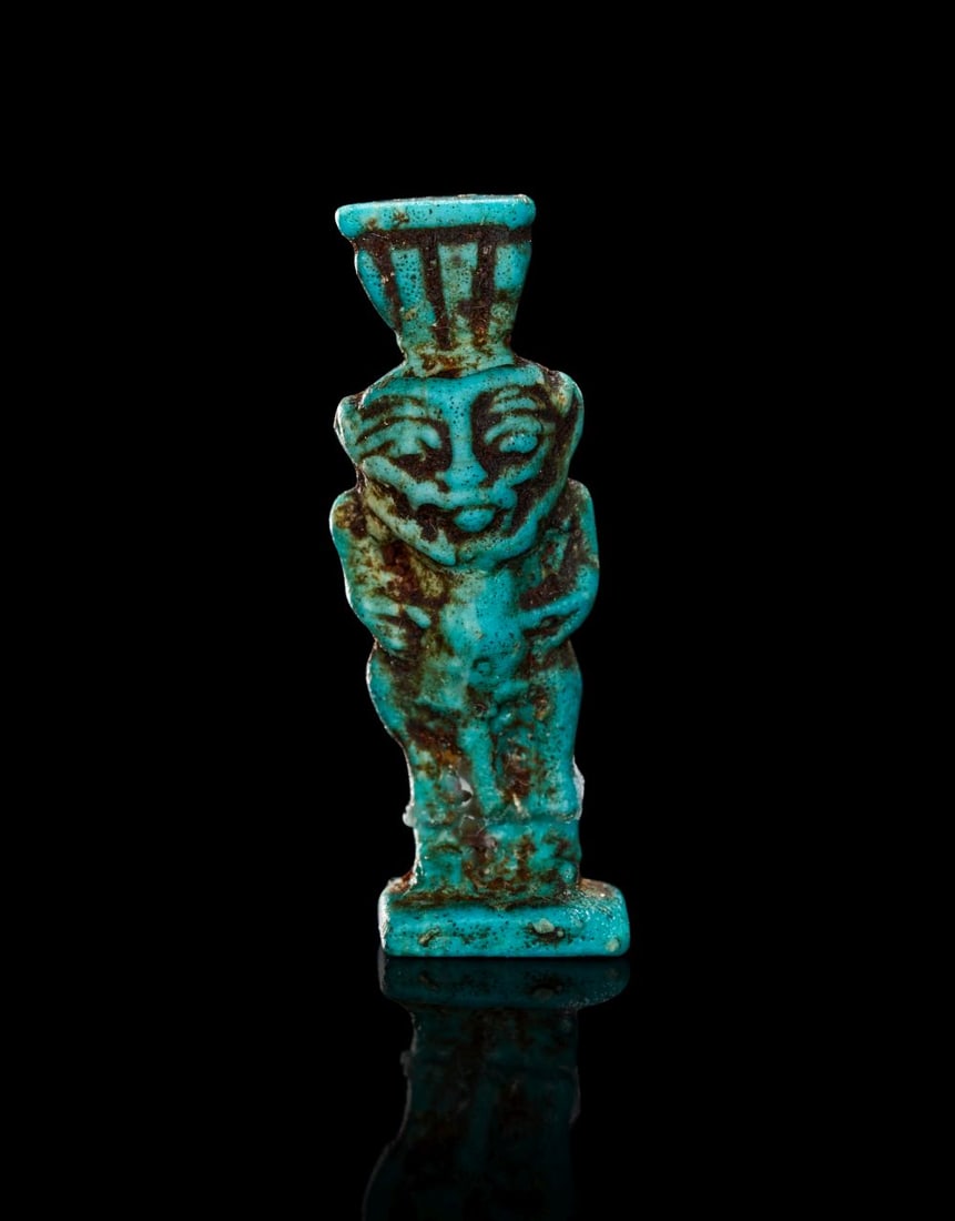AN EGYPTIAN BLUE FAIENCE BES THIRD INTERMEDIATE PERIOD, 20TH DYNASTY, 1196-1070 B.C. (1 of 3)