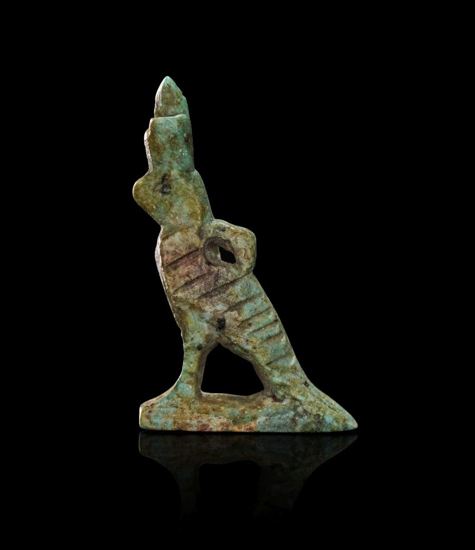 AN EGYPTIAN FAIENCE AMULET OF HORUS THE FALCON LATE PERIOD TO PTOLEMAIC PERIOD, 664-30 B.C. (1 of 2)