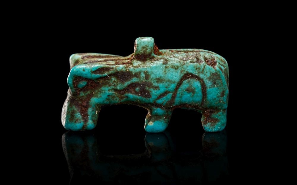 AN EGYPTIAN FAIENCE HIPPOPOTAMUS AMULET LATE PERIOD, DYNASTY XXVI, 664-525 B.C. (1 of 2)