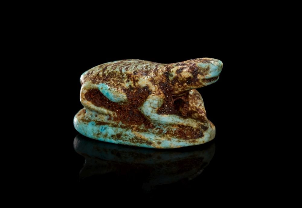 AN EGYPTIAN TURQUOISE GLAZED COMPOSITION FROG NEW KINGDOM, CIRCA 1550-1069 B.C. (1 of 2)