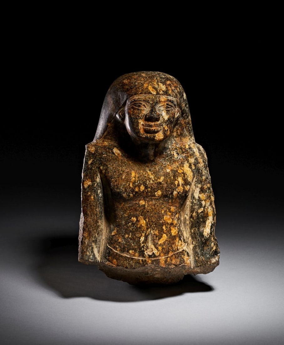 AN EGYPTIAN BLACK GRANITE BUST OF AN OFFICIAL 30TH DYNASTY TO EARLY PTOLEMAIC PERIOD, CIRCA 4TH-EARL (1 of 7)