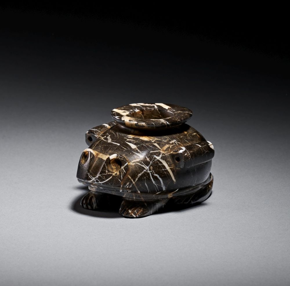 AN EGYPTIAN ANDESITE FROG VESSEL, PREDYNASTIC PERIOD, LATE NAQADA I TO LATE NAQADA II, CIRCA 3700 (1 of 5)