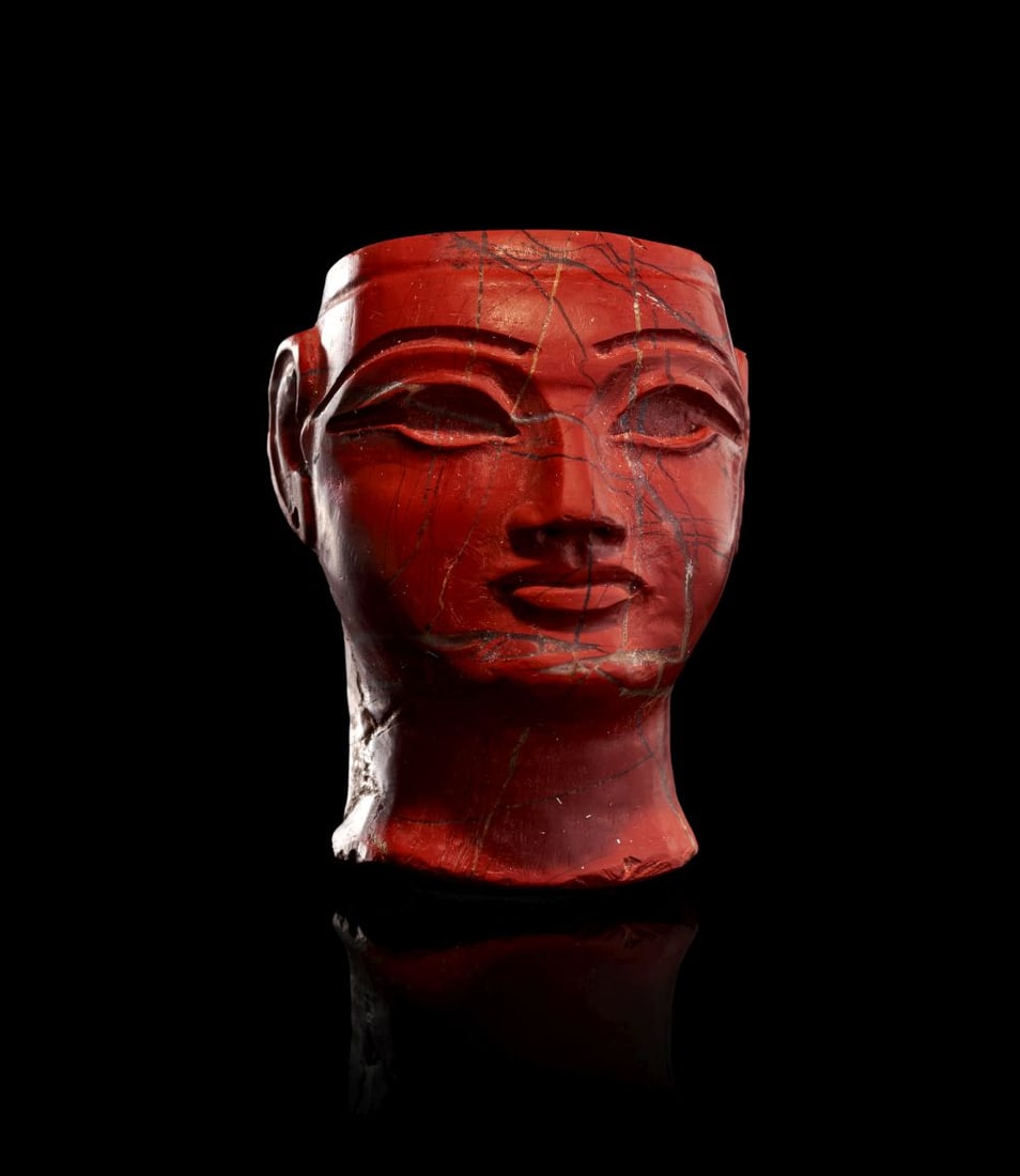 AN EGYPTIAN JASPER FACE INLAY FOR QUEEN TIYE DYNASTY XVIII, REIGN OF AMENHOTEP III, 1386-1349 B.C. (1 of 4)