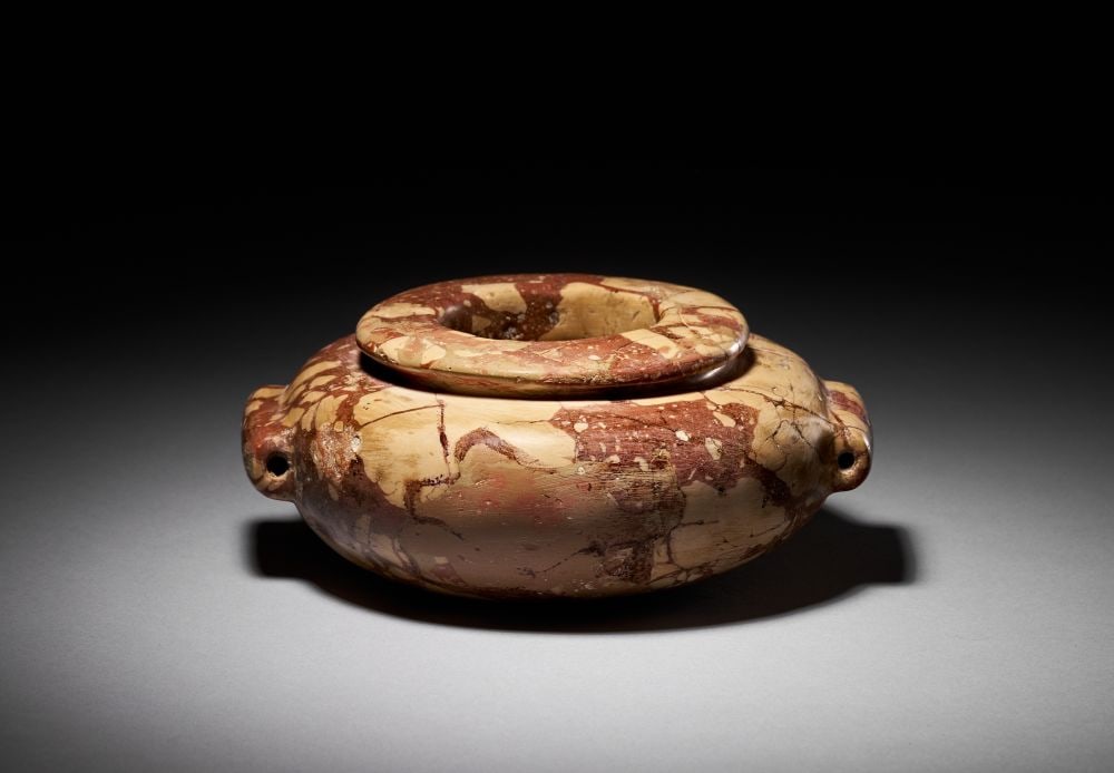 AN EGYPTIAN PREDYNASTIC BRECCIA JAR CIRCA 3200 B.C. (1 of 4)