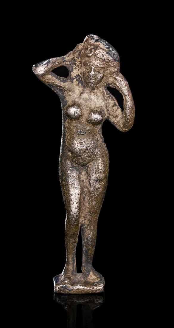 A ROMAN SILVER FIGURINE OF VENUS, CIRCA 1ST-2ND CENTURY A.D.: A ROMAN SILVER FIGURINE OF VENUS ROMAN IMPERIAL PERIOD, CIRCA 1ST–2ND CENTURY A.D. Finely cast in silver, this charming miniature figure represents Venus, the Roman goddess of love and beauty,
