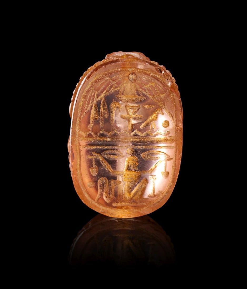 AN EGYPTIAN INSCRIBED ROCK CRYSTAL SCARAB, LATE PERIOD, DYNASTY XXVI-XXX, CIRCA 664-332 B.C. (1 of 5)