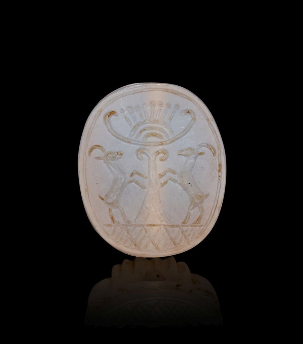 A CHALCEDONY SCARAB DEPICTING AN ANIMAL, CIRCA 5TH CENTURY B.C. (1 of 4)
