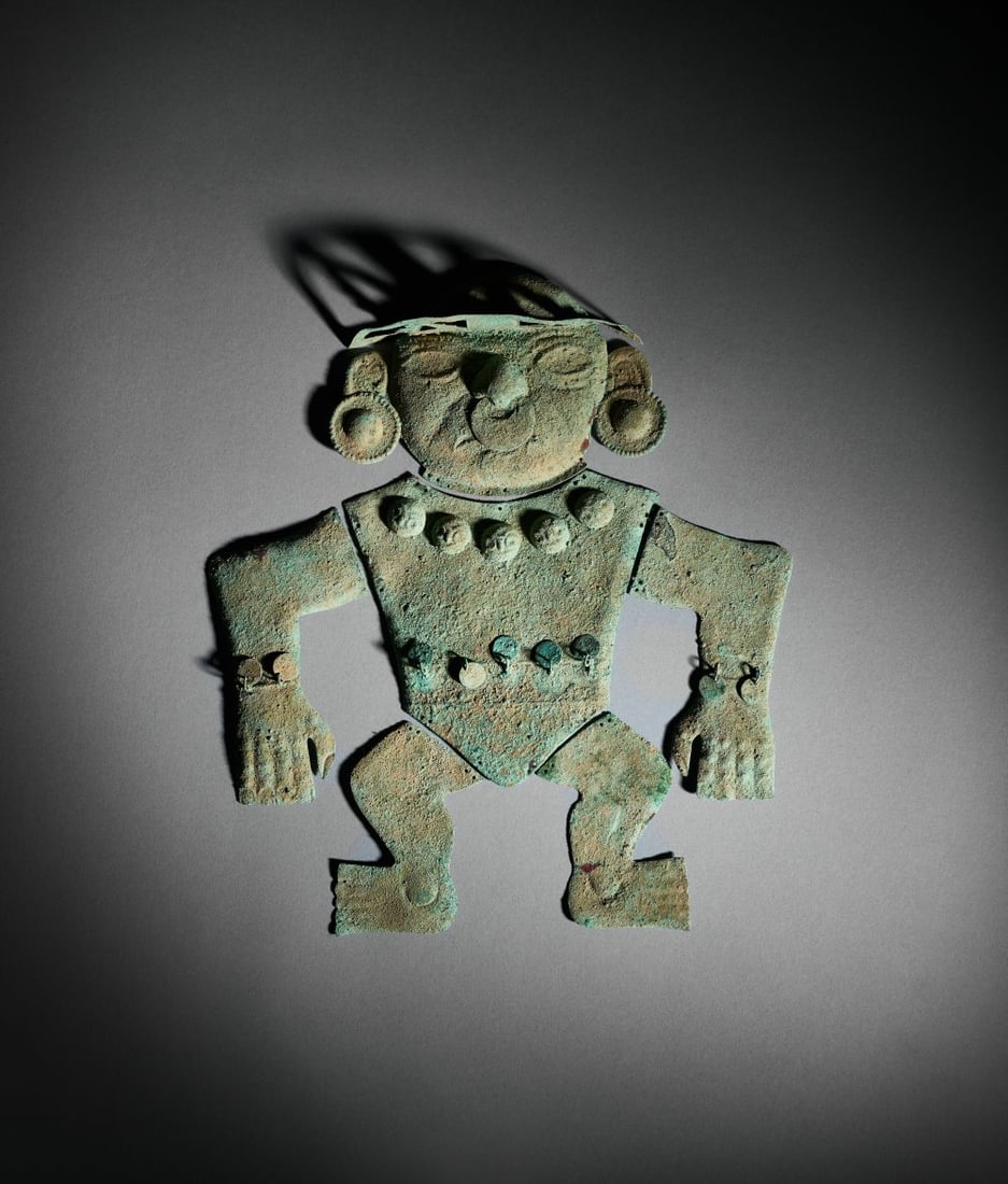 A PRE-COLOMBIAN COPPER MOCHE FIGURE Circa 800–1200 A.D. (1 of 2)