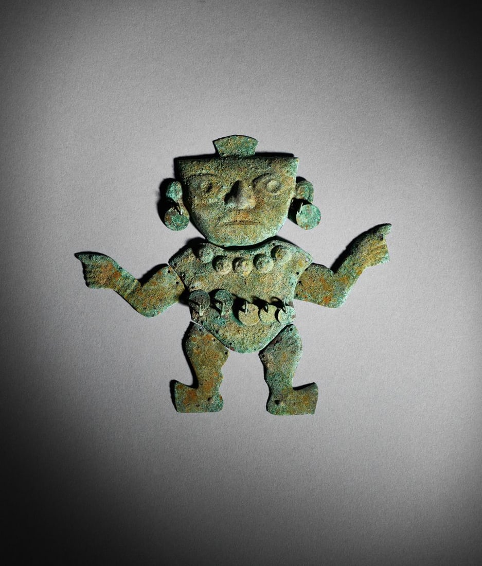 A PRE-COLOMBIAN COPPER MOCHE FIGURE Circa 800–1200 A.D. (1 of 2)