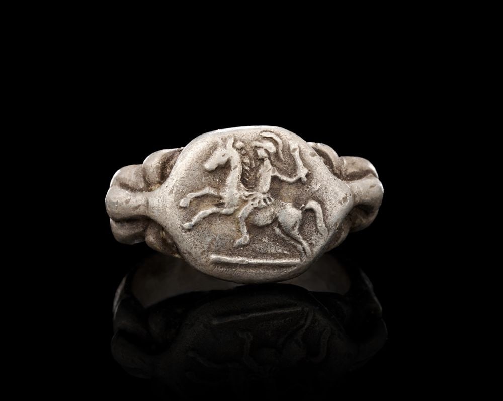 A ROMAN SILVER SOLDIER RIDING HORSE RING, CIRCA 2ND CENTURY A.D. (1 of 4)