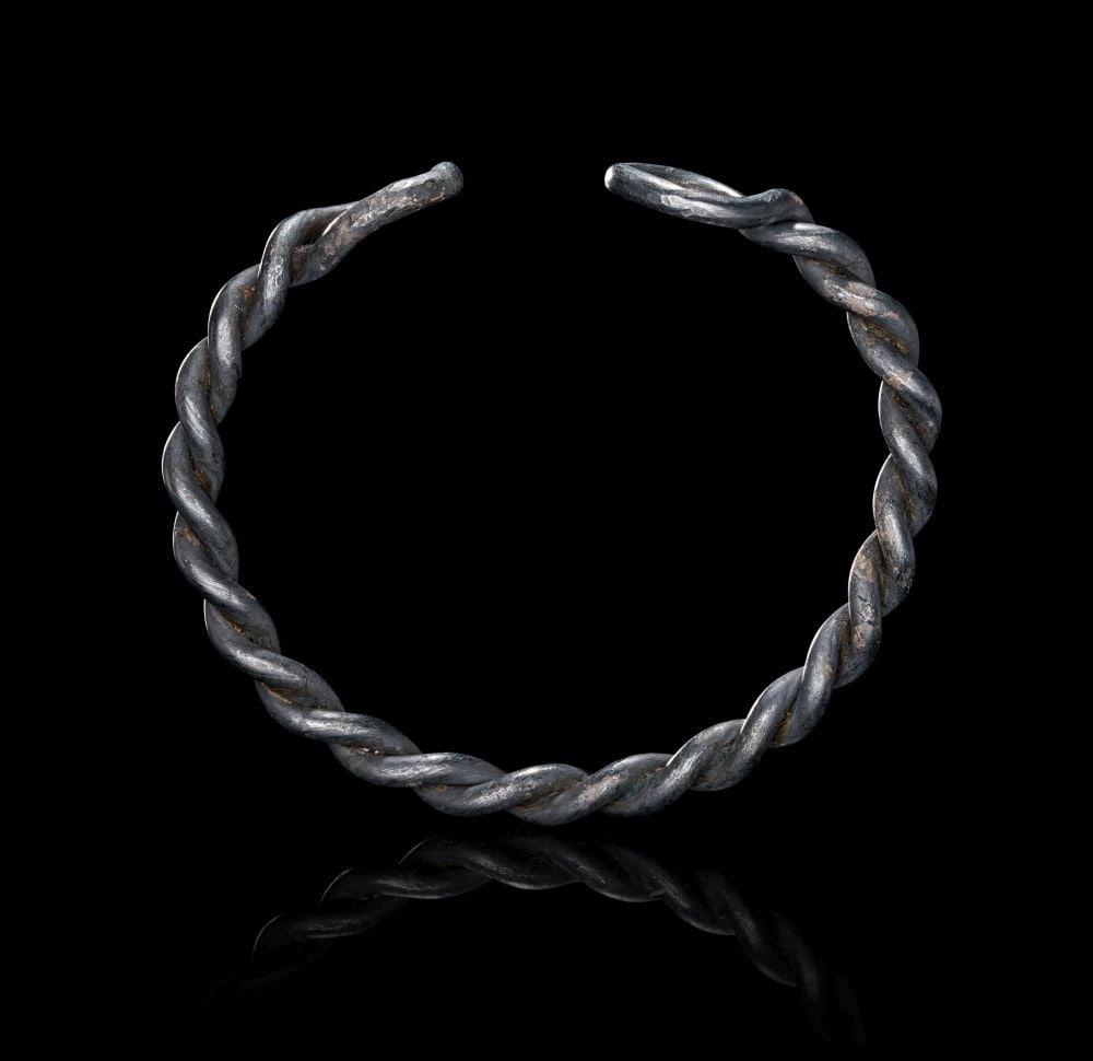 A VIKING SILVER BRACELET, CIRCA 9TH-10TH CENTURY A.D. (1 of 2)