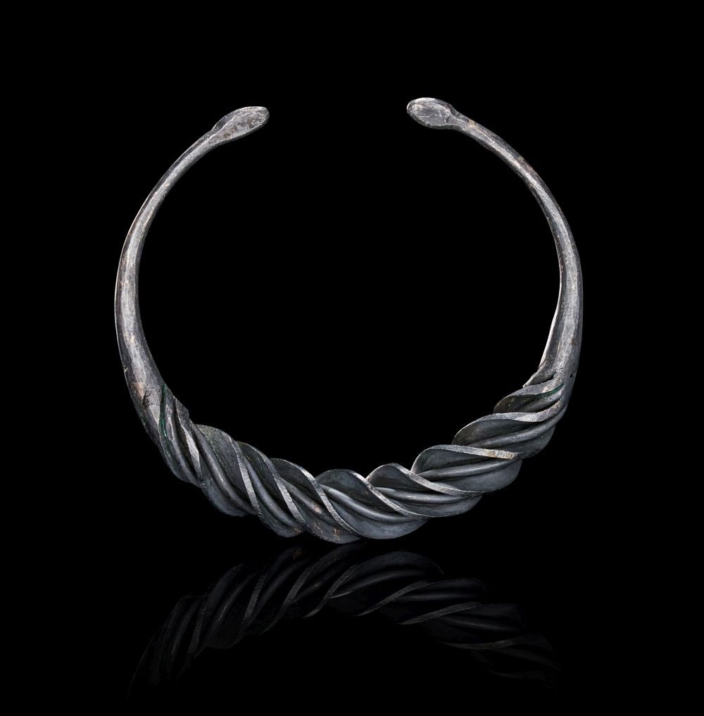 A VIKING SILVER BRACELET, CIRCA 9TH-10TH CENTURY A.D. (1 of 2)