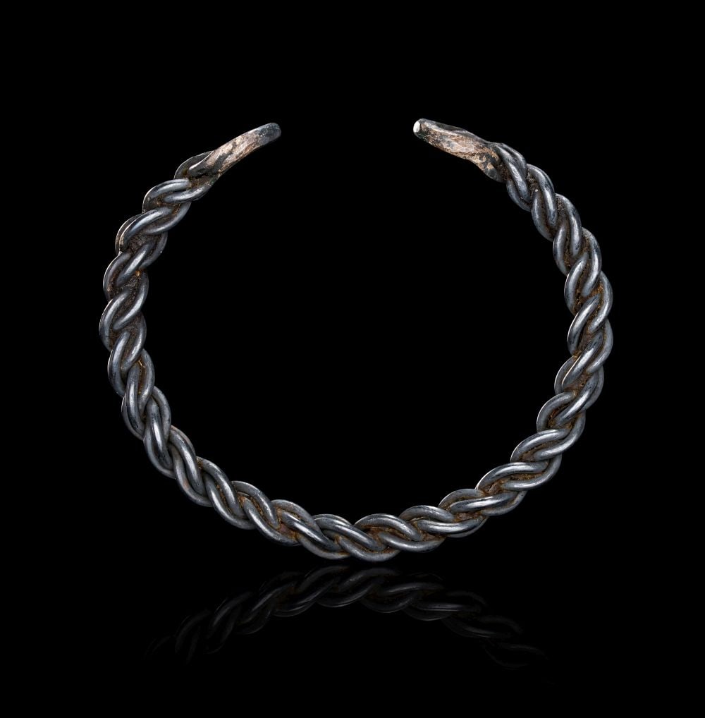 A VIKING SILVER BRACELET, CIRCA 9TH-10TH CENTURY A.D. (1 of 2)