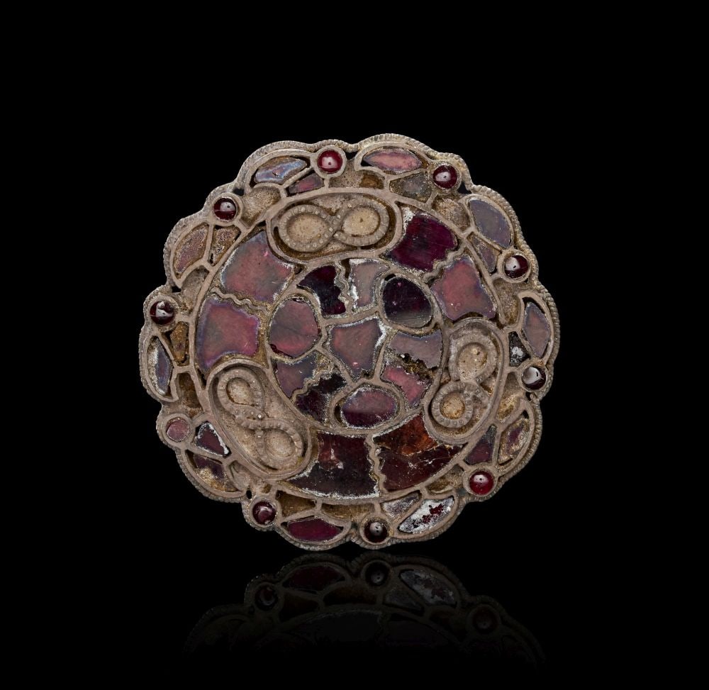 A MEROVINGIAN SILVER AND GARNET APPLIQUE PENDANT, CIRCA 5TH-6TH CENTURY A.D. (1 of 2)