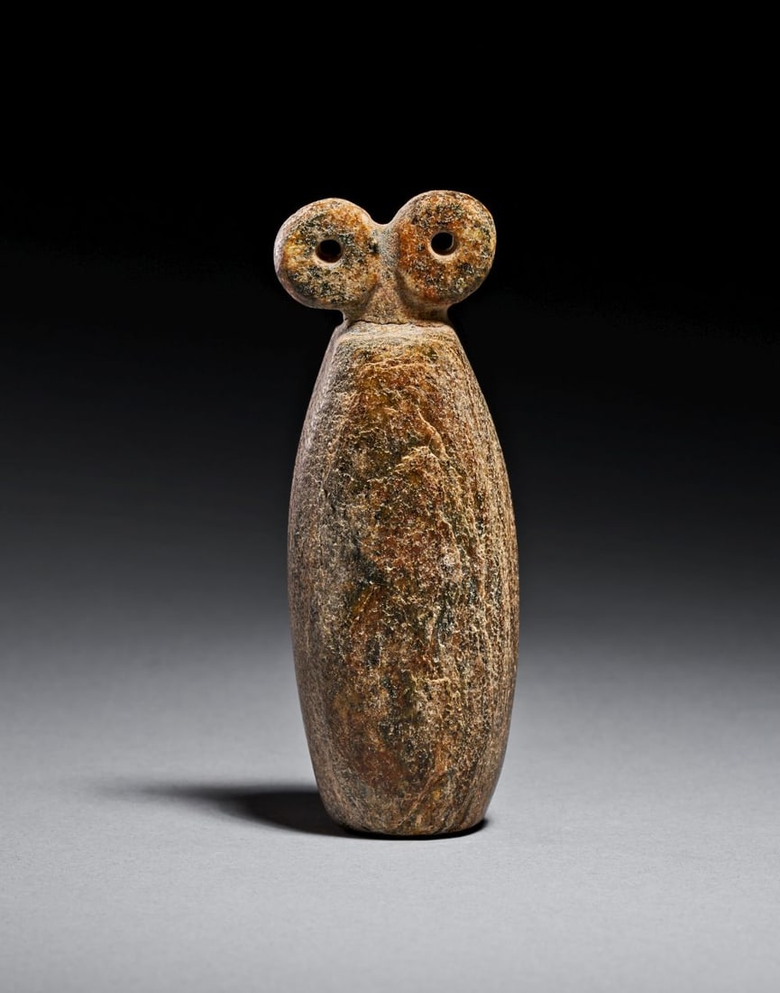 A MESOPOTAMIAN STONE SPECTACLE IDOL, CIRCA 3000 B.C. (1 of 3)