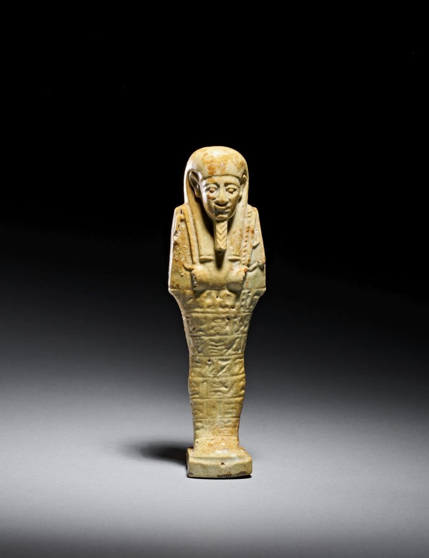 AN EGYPTIAN FAIENCE SHABTI, LATE PERIOD, 26TH DYNASTY, CIRCA 6TH CENTURY B.C (1 of 4)