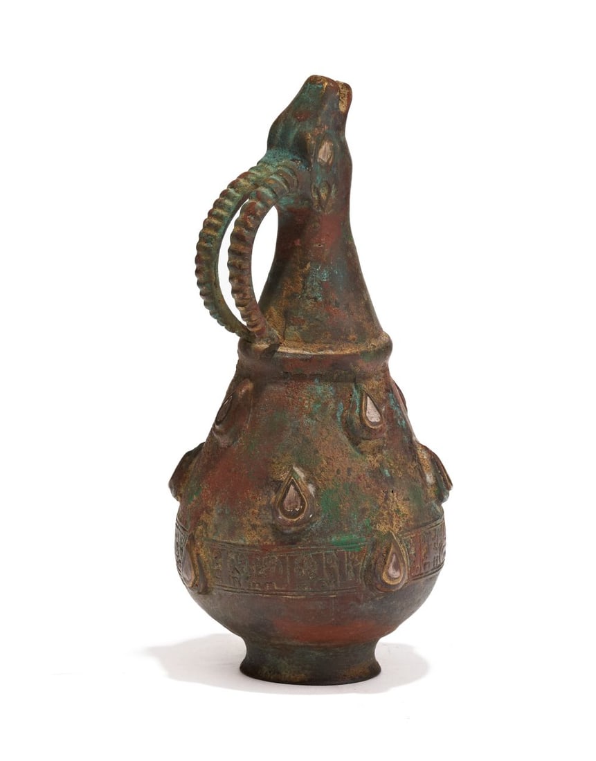 A KHORASAN ANTHROPOMORPHIC BRONZE & SILVER INLAID EWER, IRAN, 12TH CENTURY (1 of 4)