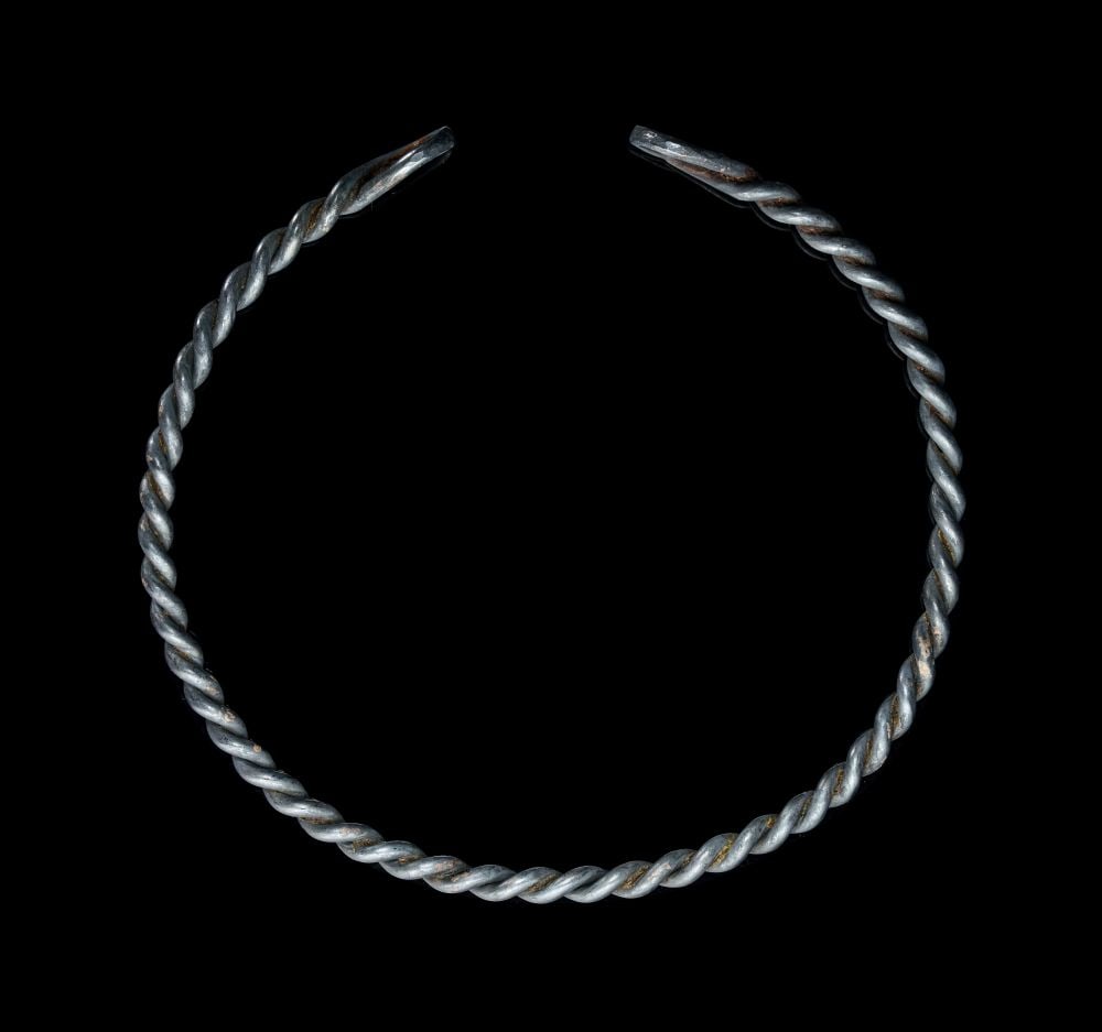 A LARGE VIKING TWISTED SILVER CHOKER NECKLACE, CIRCA 9TH-10TH CENTURY A.D.: A LARGE VIKING TWISTED SILVER CHOKER NECKLACE, CIRCA 9TH–10TH CENTURY A.D. Formed from solid silver rods tightly twisted into a robust torc-like circlet, this imposing Viking choker commands a