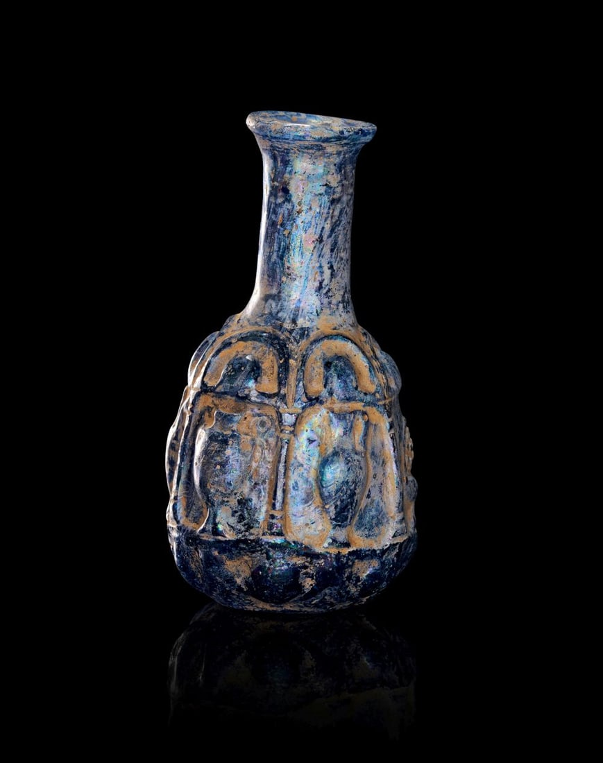 A ROMAN DEEP BLUE GLASS "URN" BOTTLE, CIRCA 1ST-2ND CENTURY (1 of 3)