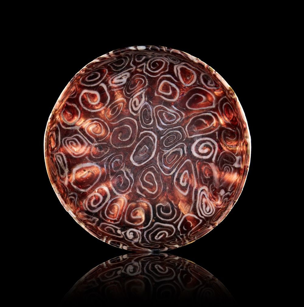 A ROMAN BROWN AND WHITE MOSAIC GLASS BOWL, CIRCA 1ST CENTURY B.C.–1ST CENTURY A.D.: A ROMAN BROWN AND WHITE MOSAIC GLASS BOWL, CIRCA 1ST CENTURY B.C.–1ST CENTURY A.D. Finely cast