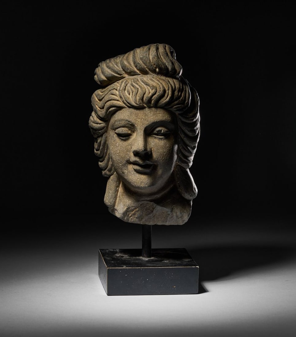 A GREY SCHIST HEAD OF A BODHISATTVA, GANDHARA, CIRCA 4TH CENTURY (1 of 4)