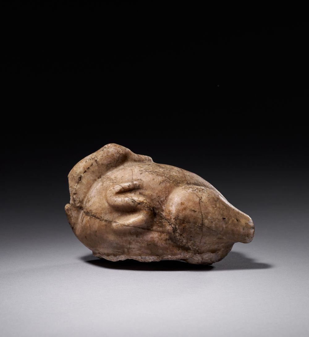 AN EGYPTIAN ALABASTER PREDYNASTIC DUCK WEIGHT, PREDYNASTIC PERIOD, NAQADA I-II, CIRCA 4000-3200 B.C. (1 of 3)