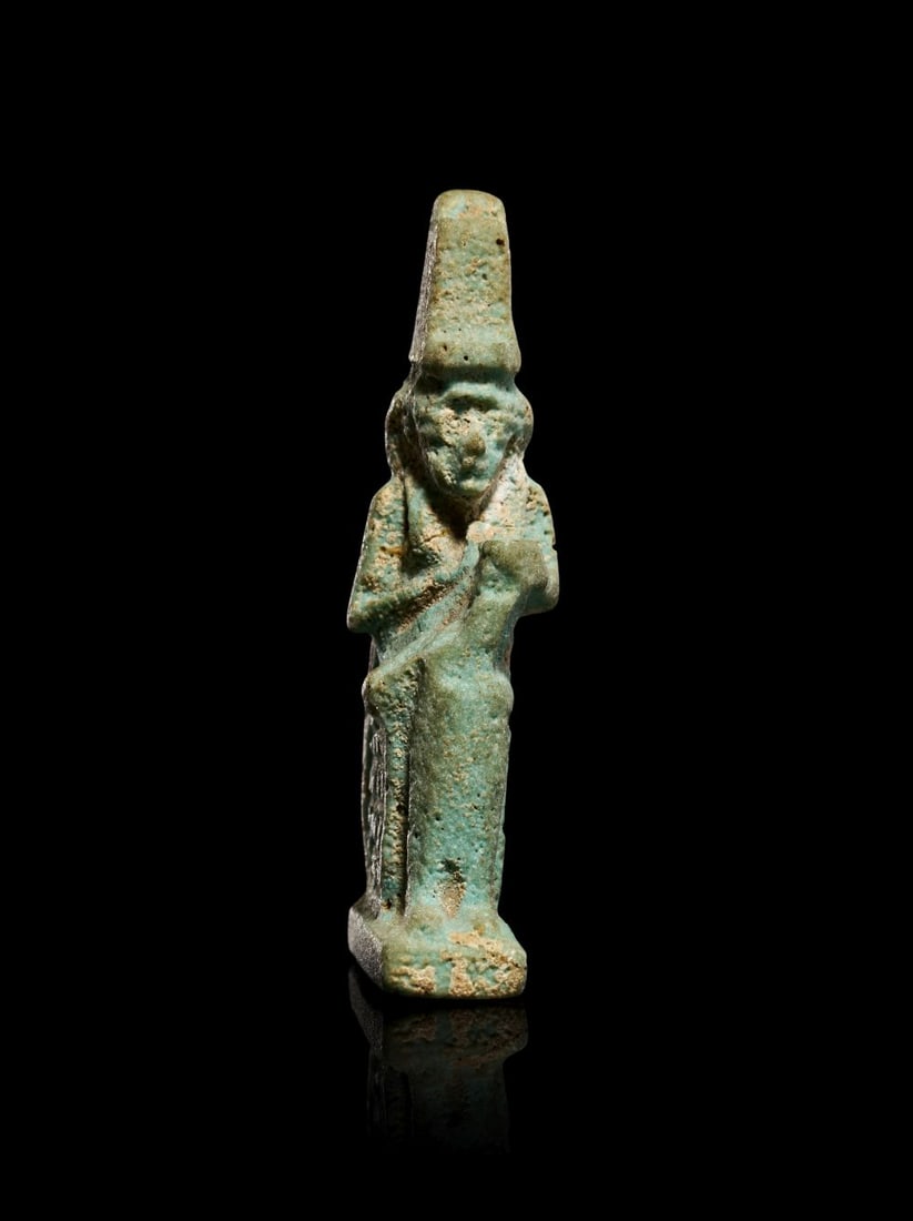 AN EGYPTIAN FAIENCE FIGURE OF ISIS NURSING HORUS, PTOLEMAIC PERIOD, CIRCA 332-30B.C. (1 of 3)