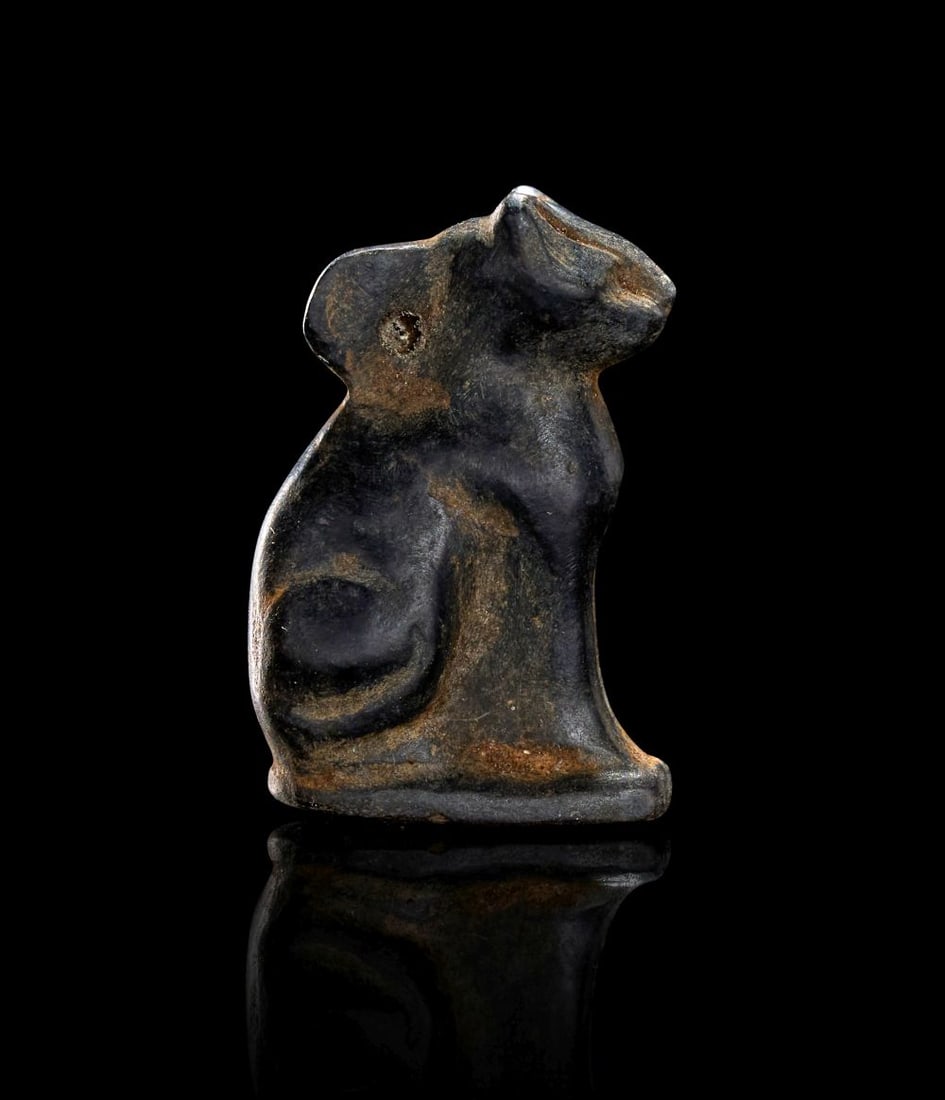 AN EGYPTIAN BLACK JASPER CAT AMULET, PTOLEMAIC PERIOD, CIRCA 332-30B.C. (1 of 2)
