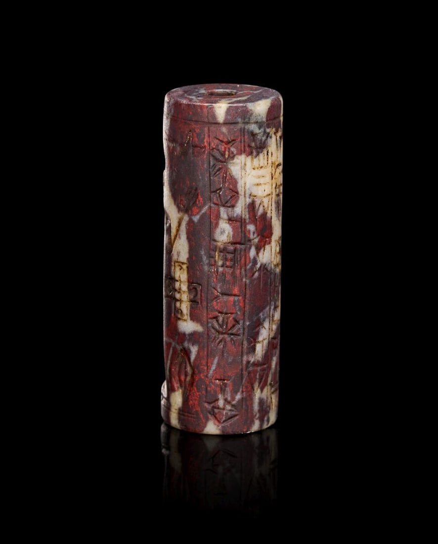 A CUNEIFORM INSCRIBED JASPER ASSYRIAN CYLINDER SEAL, CIRCA 750-600 B.C. (1 of 3)