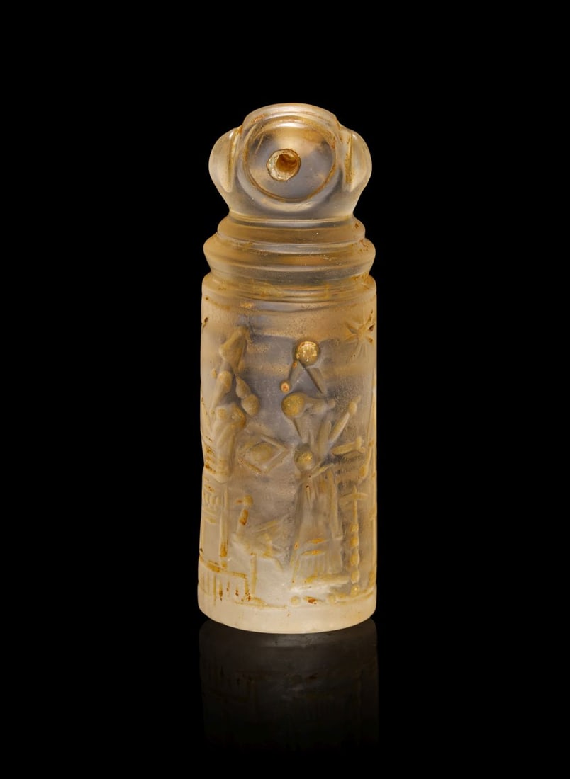A NEO-BABYLONIAN ROCK CRYSTAL CYLINDER SEAL CIRCA 900-700 B.C. (1 of 4)