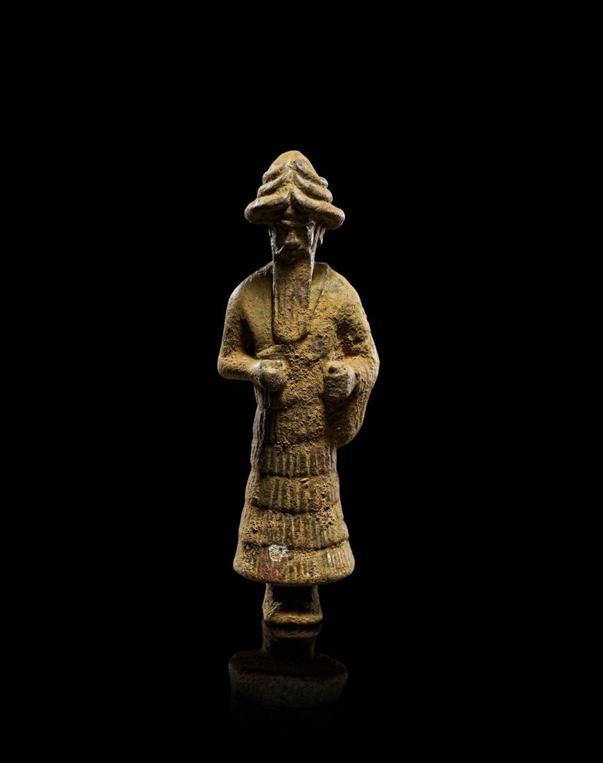 AN ELAMITE BRONZE FIGURE OF GOD INSHUSHINAK, CIRCA LATE 3RD-EARLY 2ND MILLENNIUM B.C. (1 of 3)