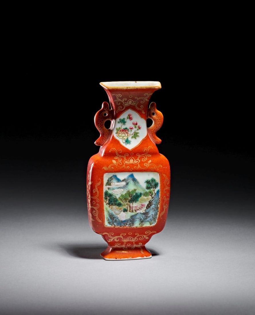 A CORAL RED GILT LANDSCAPE DECORATED WALL VASE, QIANLONG PERIOD (1736-1795): A CORAL-RED GILT LANDSCAPE-DECORATED WALL VASE, QIANLONG PERIOD (1736–1795) Elegantly moulded in flattened baluster form with a flared rectangular mouth and gently tapering foot, this porcelai