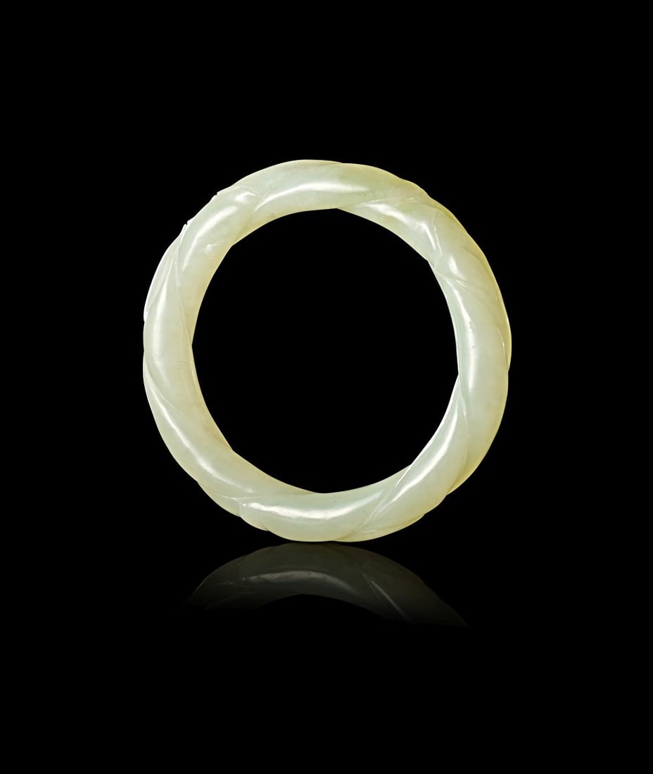 A CHINESE GREENISH-WHITE JADE BANGLE (1 of 4)