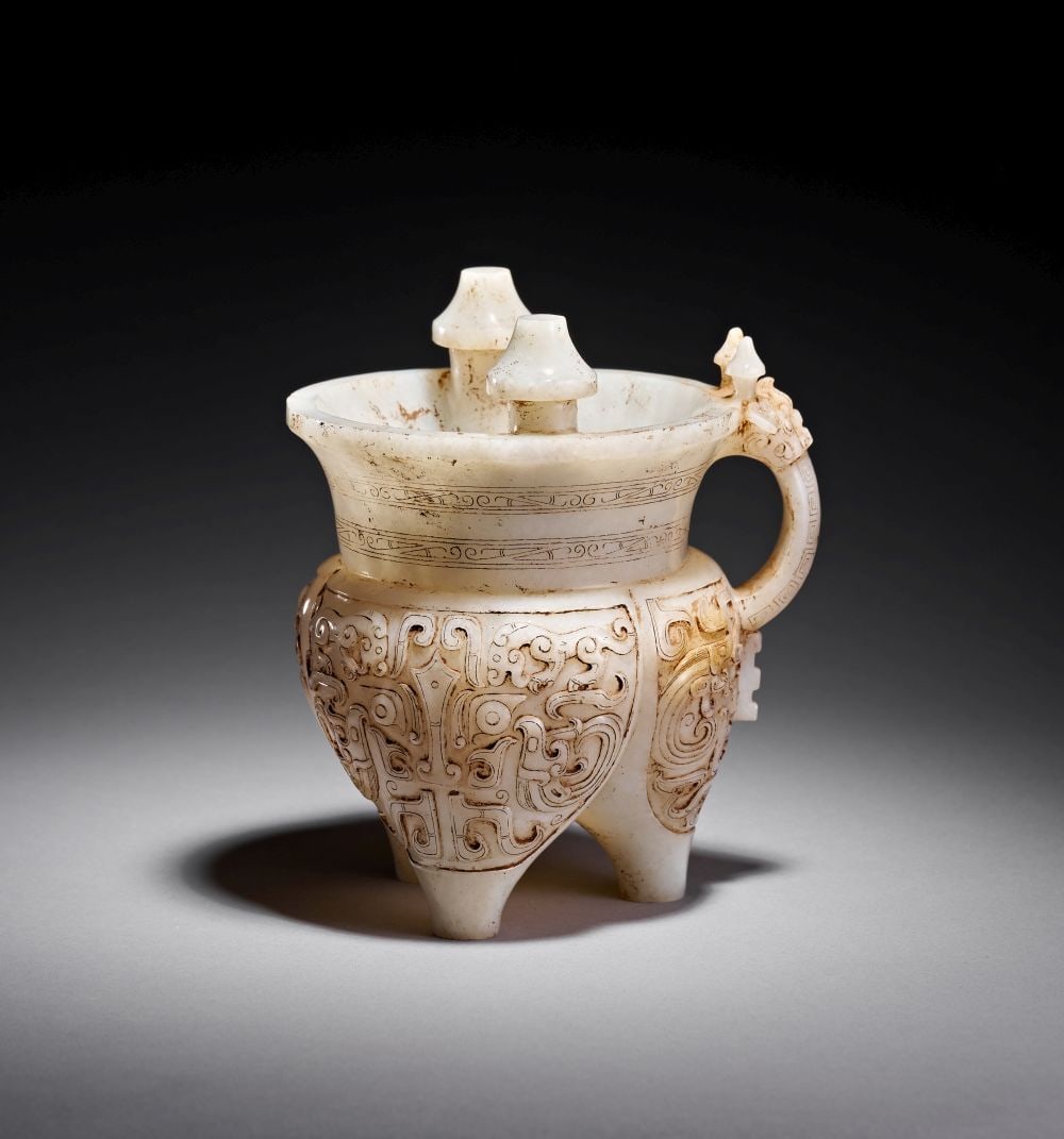 A CHINESE WHITE JADE WINE VESSEL (JIA), QING DYNASTY (1644-1911) (1 of 9)